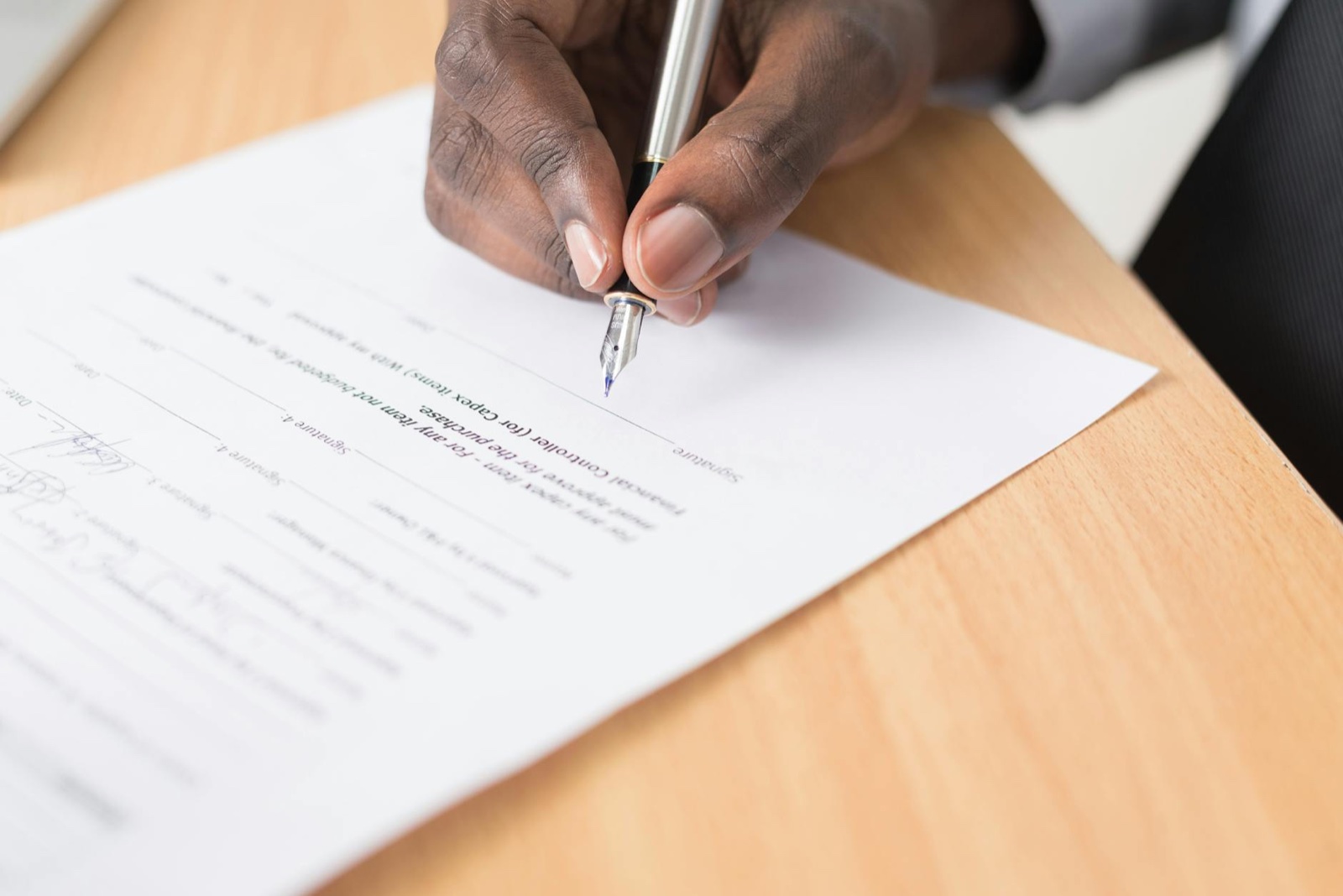 POPIA compliance documents and contract on desk for LMS data processing