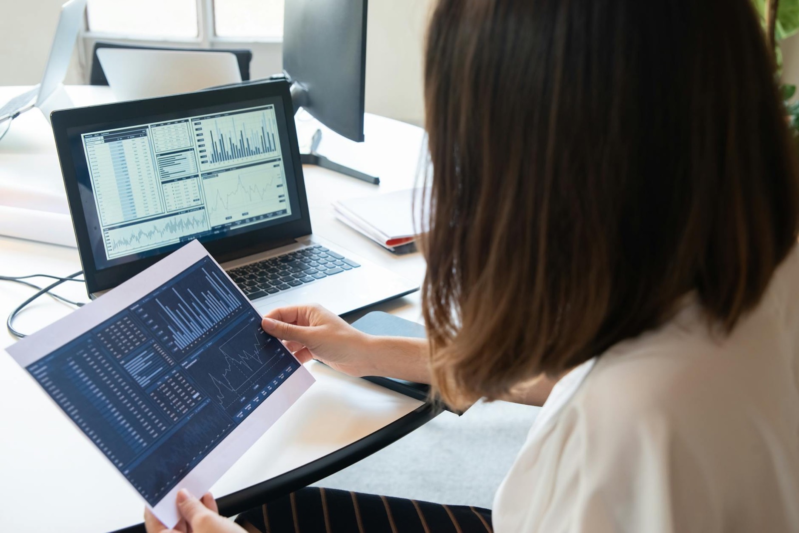 Marketer reviewing website conversion data and heatmaps on screen