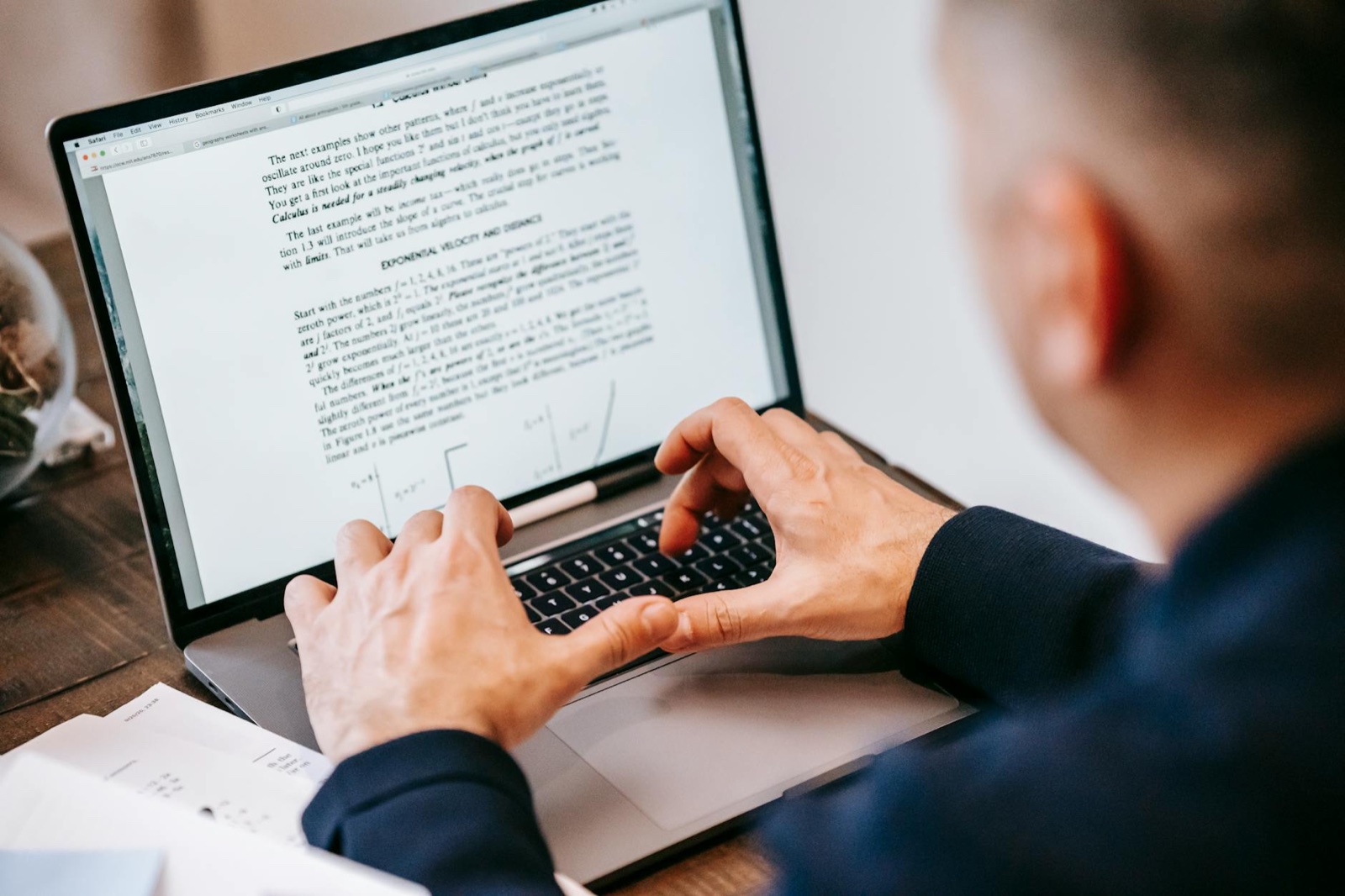 SMB owner editing AI-generated draft on screen with notes